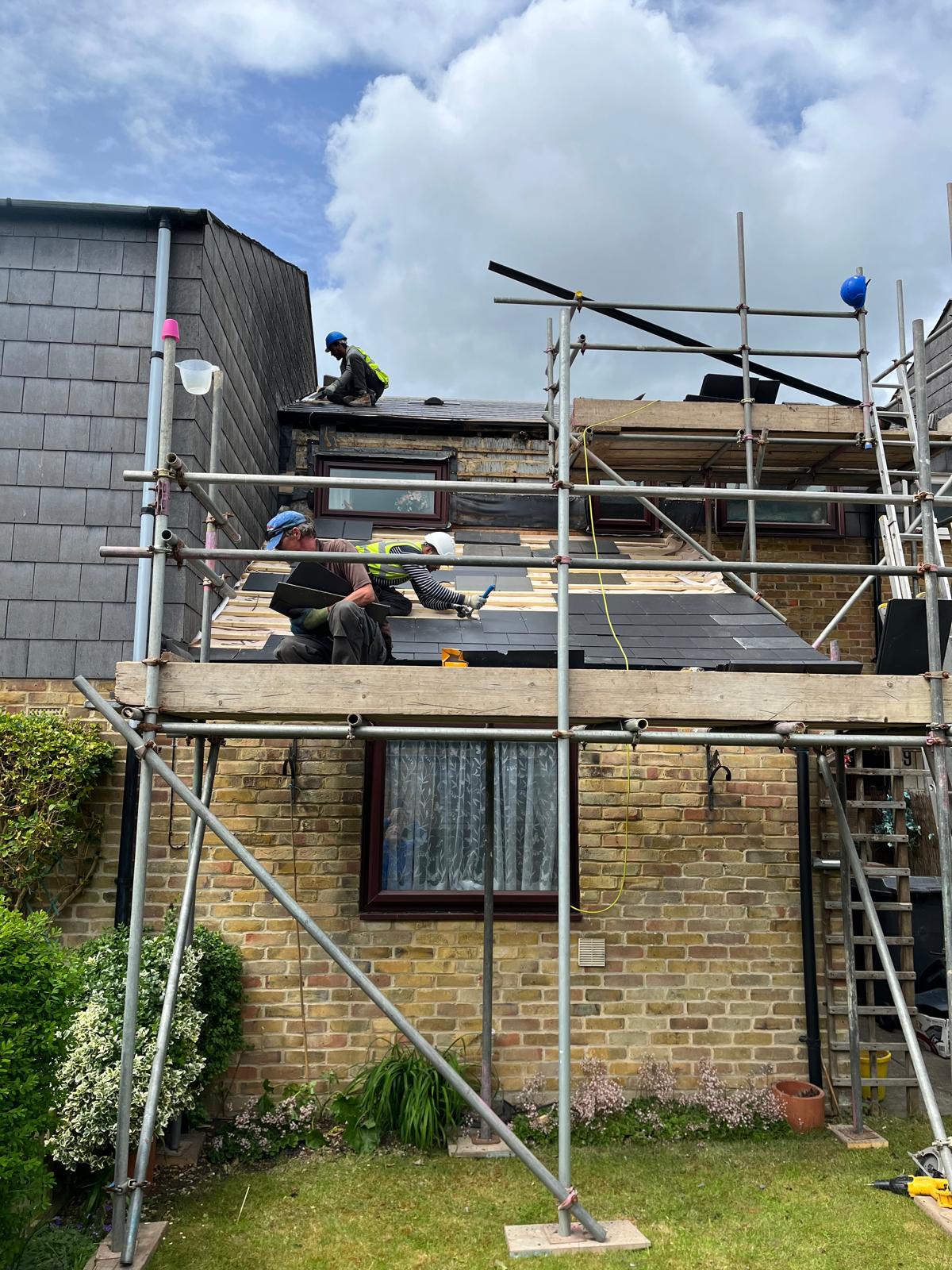 Scaffolding up for a full re-roof on a brick house