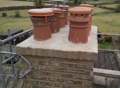 Repointed chimney stack with clay pots